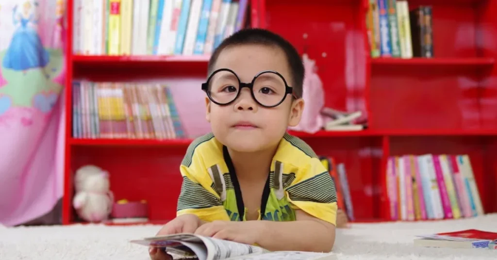Boy Standing Near Bookshelf