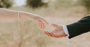 Close-Up of Hands Reaching Outdoors