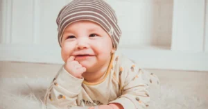 Smiling Baby Biting Right Index Finger