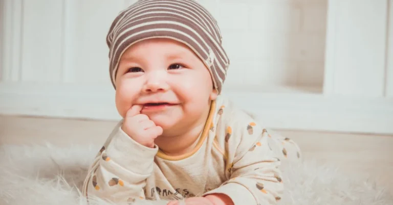 Smiling Baby Biting Right Index Finger