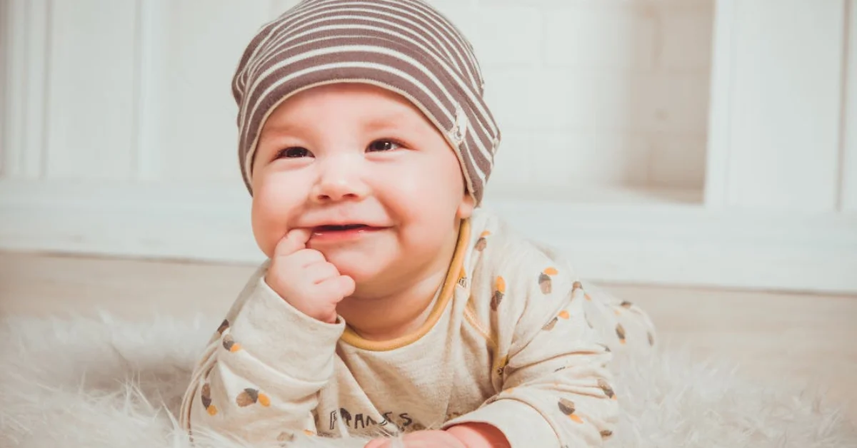 Smiling Baby Biting Right Index Finger